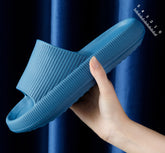 Comfortable CheapSeasons Cloud slippers with soft, cushioned soles and non-slip design for cozy indoor wear.