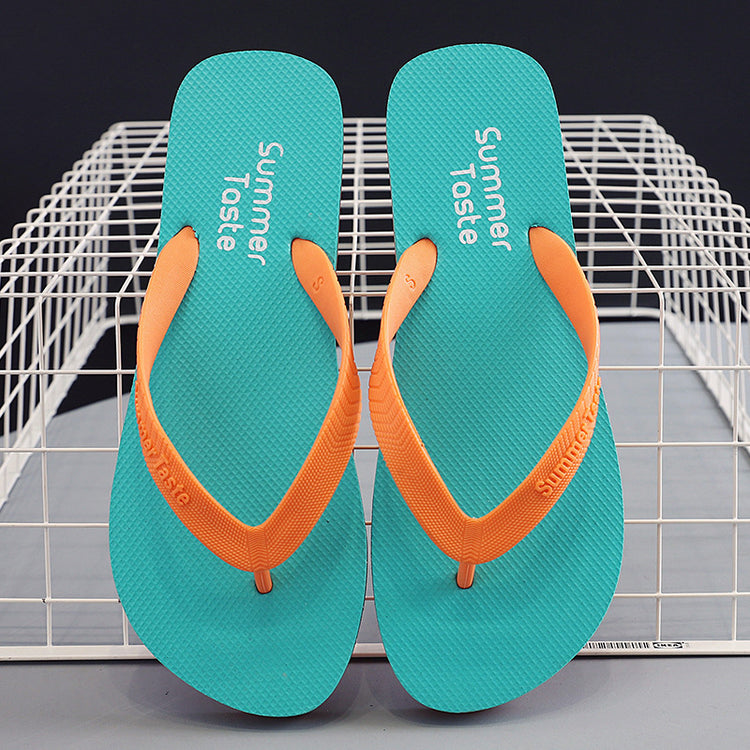 Pair of CheapSeasons flip flops in vibrant summer colors, casual footwear perfect for warm weather and beach outings.