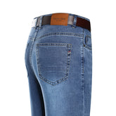 Premium straight jeans by CheapSeasons featuring a classic fit and comfortable design, shown in a natural denim color.