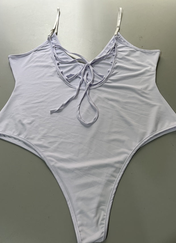 CheapSeasons beach and club body in vibrant fabric, featuring a stylish cut and comfortable fit for summer swimwear and nightlife.