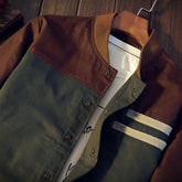 Color-block statement jacket by CheapSeasons featuring vintage vibes and urban rugged style in earthy tones.