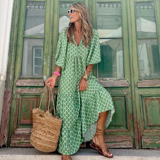 Green floral boho maxi dress from CheapSeasons, featuring a lightweight, airy summer style with flowing fabric and bohemian design.