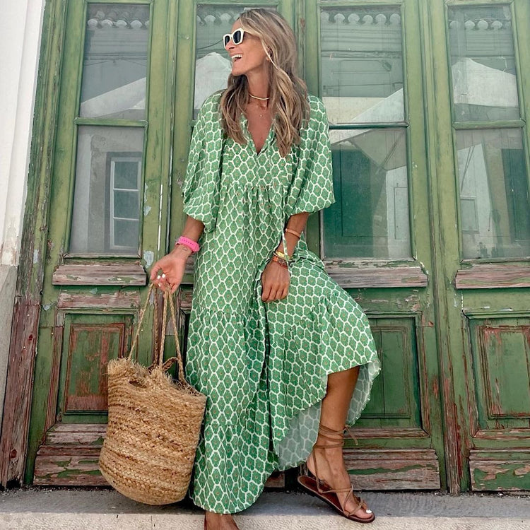 Green floral boho maxi dress from CheapSeasons, featuring a lightweight, airy summer style with flowing fabric and bohemian design.