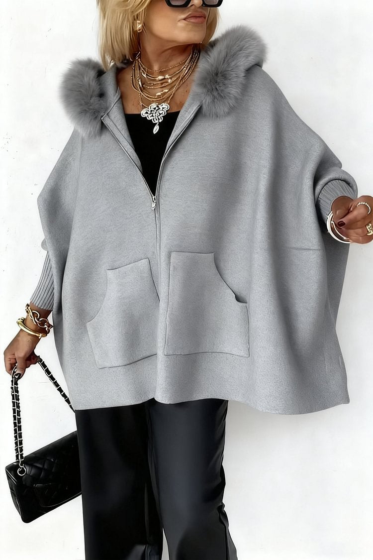 Luxurious hooded cape with fur accent from CheapSeasons, featuring cozy fabric and elegant design for stylish winter wear.