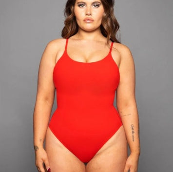 Bright yellow CheapSeasons beach and club body with sleek design, perfect for stylish summer beach and nightlife wear.