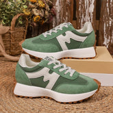 Hybrid sneaker by CheapSeasons featuring a modern design with sleek black and white details, showcasing stylish footwear for confident looks.