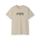 Urban Edge Praying Statement-Shirt by CheapSeasons featuring bold graphic design on a casual, stylish unisex tee.