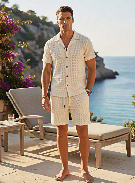 Light-colored Riviera linen resort set by CheapSeasons displayed on a model in a tropical setting.